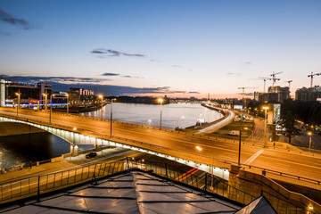 Fototapeta na wymiar Kantemirovsky bridge and Vyborgskaya Quay in Saint Petersburg