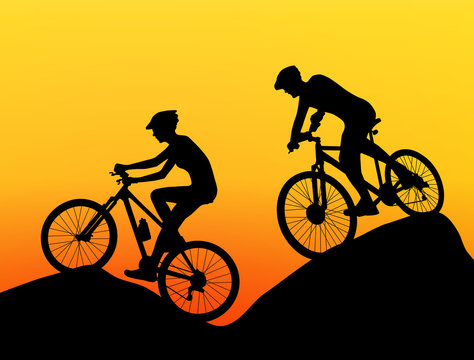 two cyclists silhouette extreme biking