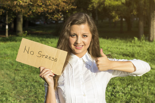Girl holding paper with inscription no stress. No stress concept