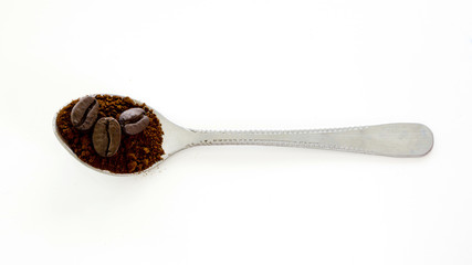 Instant coffee with roast coffee bean in the spoon