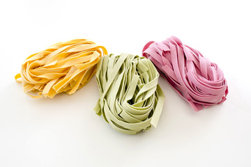 Bundles of dried ribbon color  pasta