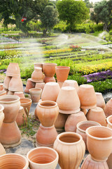 Fototapeta na wymiar Pile of terracotta flower containers 