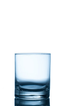 Empty glass for whiskey, water, juice on white