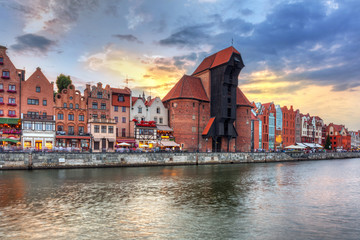 Fototapeta premium Gdansk at sunset with reflection in Motlawa river, Poland