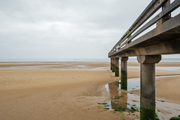 Pier in the Omaha beach. Omaha beach is located on the coast of