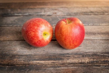 red apples on wooden table