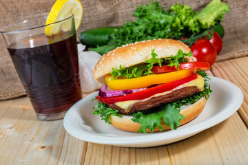 hamburger and drink with slice of lemon