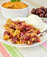 Crumble cherry with berries on plate