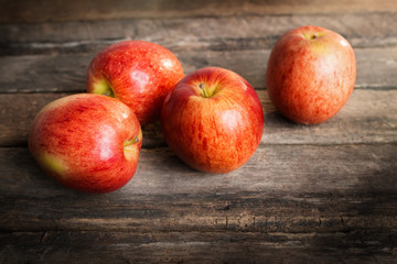 red apples on wooden table