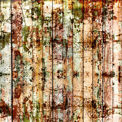 Old painted wooden fence with paint peeling