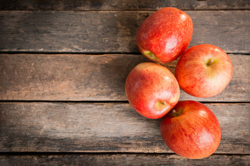 red apples on wooden table