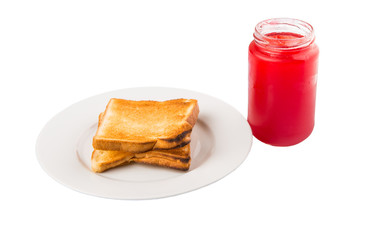 Strawberry jam and bread toast on a plate over white background 