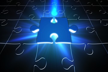 Blue glowing jigsaw piece on puzzle