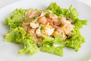 Stir fried fresh rice-flour noodles with chicken and egg.