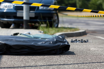 Corpse in plastic bag after car accident