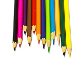 Colour pencils on white background close up