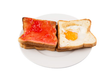 Bread toast with fried egg and strawberry jam