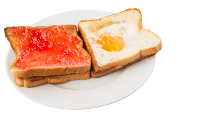 Bread toast with fried egg and strawberry jam