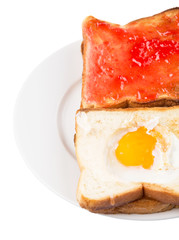 Bread toast with fried egg and strawberry jam