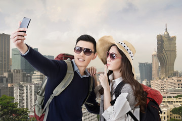 Asian couple travel and selfie