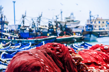Fishing nets with a busy habror in the background