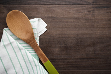wooden spoon on the brown table