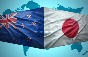 Waving New Zealand and Japanese flags