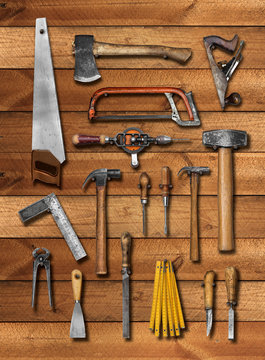 Old carpenter hand tools on wood