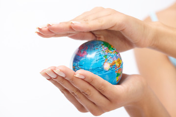 woman's hand with globe