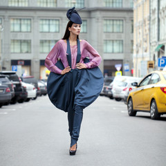 Fototapeta premium Young beautiful model in a stylish designer clothes