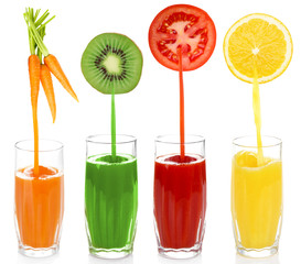 Juice pouring from fruits and vegetables into glass, isolated