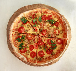 Delicious fresh pizza served on wooden plate