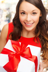 close up of smiling woman with gift box