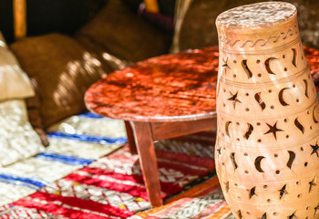Oriental style sitting and traditional pot on the foreground