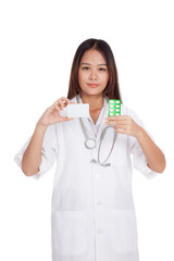 Asian young female doctor show a blank card with medicine