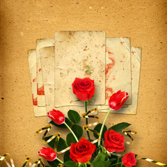Old vintage album for photos with a bouquet of red roses and tul