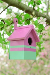 Birdhouse in garden outdoors