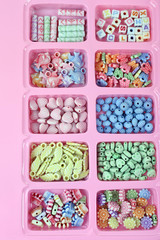 Multicoloured beading kit for children in a pink box