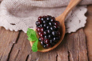 Wooden bowl of blueberries