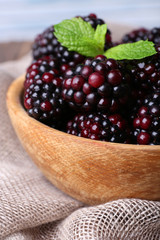 Wooden bowl of blueberries