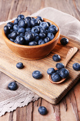 Wooden bowl of blueberries