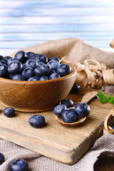 Wooden bowl of blueberries
