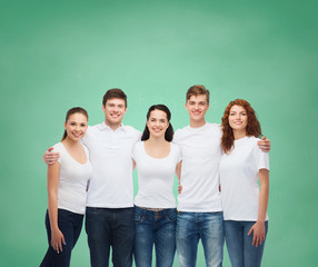 group of smiling teenagers in white blank t-shirts