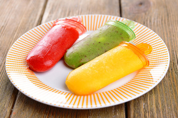 Delicious ice cream on plate on table close-up