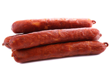 Smoked thin sausages, isolated on white