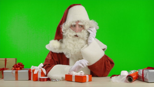 Santa Claus is Getting a Call on his Cell Phone - Bad News