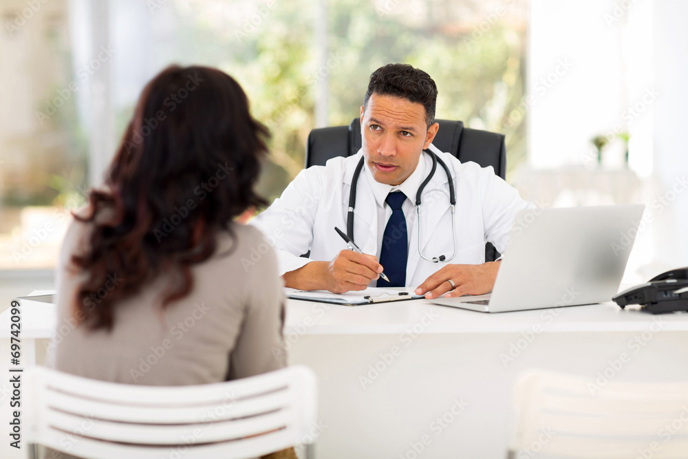 Wall mural medical doctor consulting patient in office