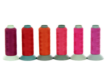 Thread spools on white background