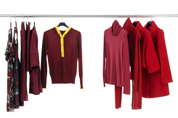 Designer fashion clothing hanging as display.