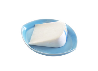 cheese in ceramic dish on white background